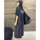 Back of grey vintage washed T-shirt dress with small cartoon figure and letters