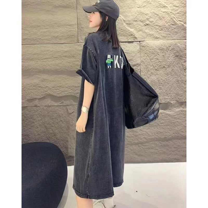 Back of grey vintage washed T-shirt dress with small cartoon figure and letters