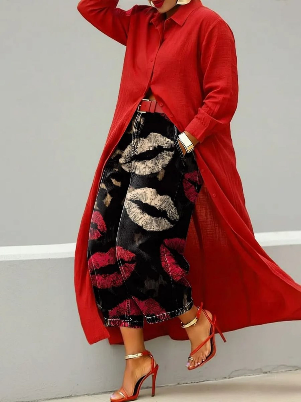 Wide leg cropped black denim jeans with cream and red lip print pattern, red coat and red heels
