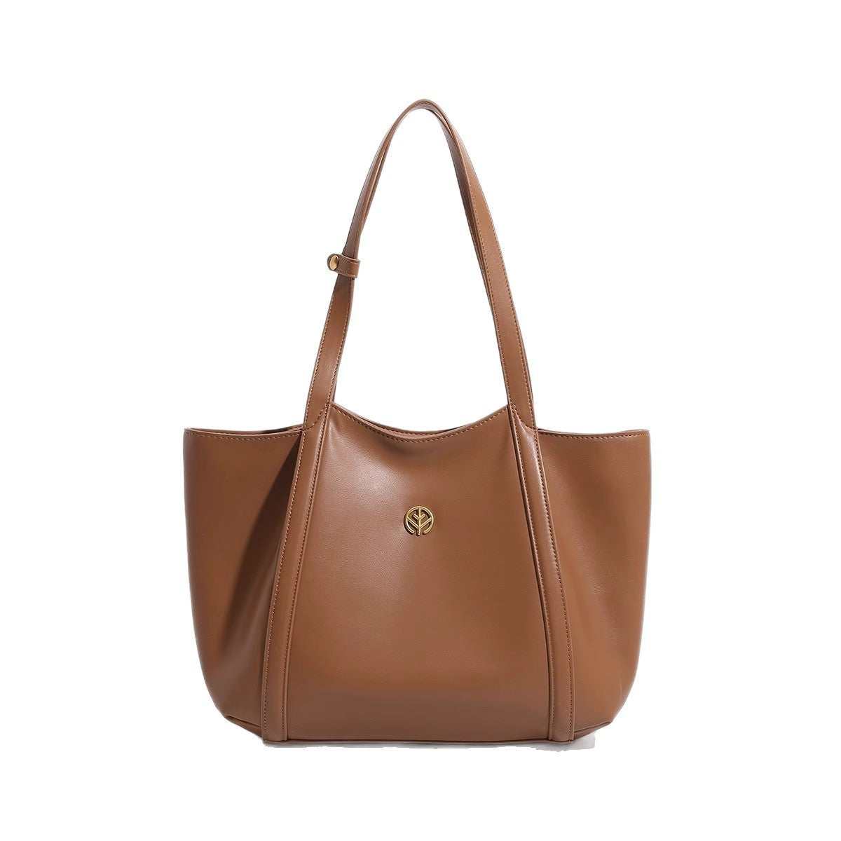 Faux leather shoulder tote carried over the shoulder in a daily setting