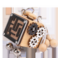 Maze version wooden busy cube with windowed bead maze, wooden gears, silver jingle bells and beads on cord