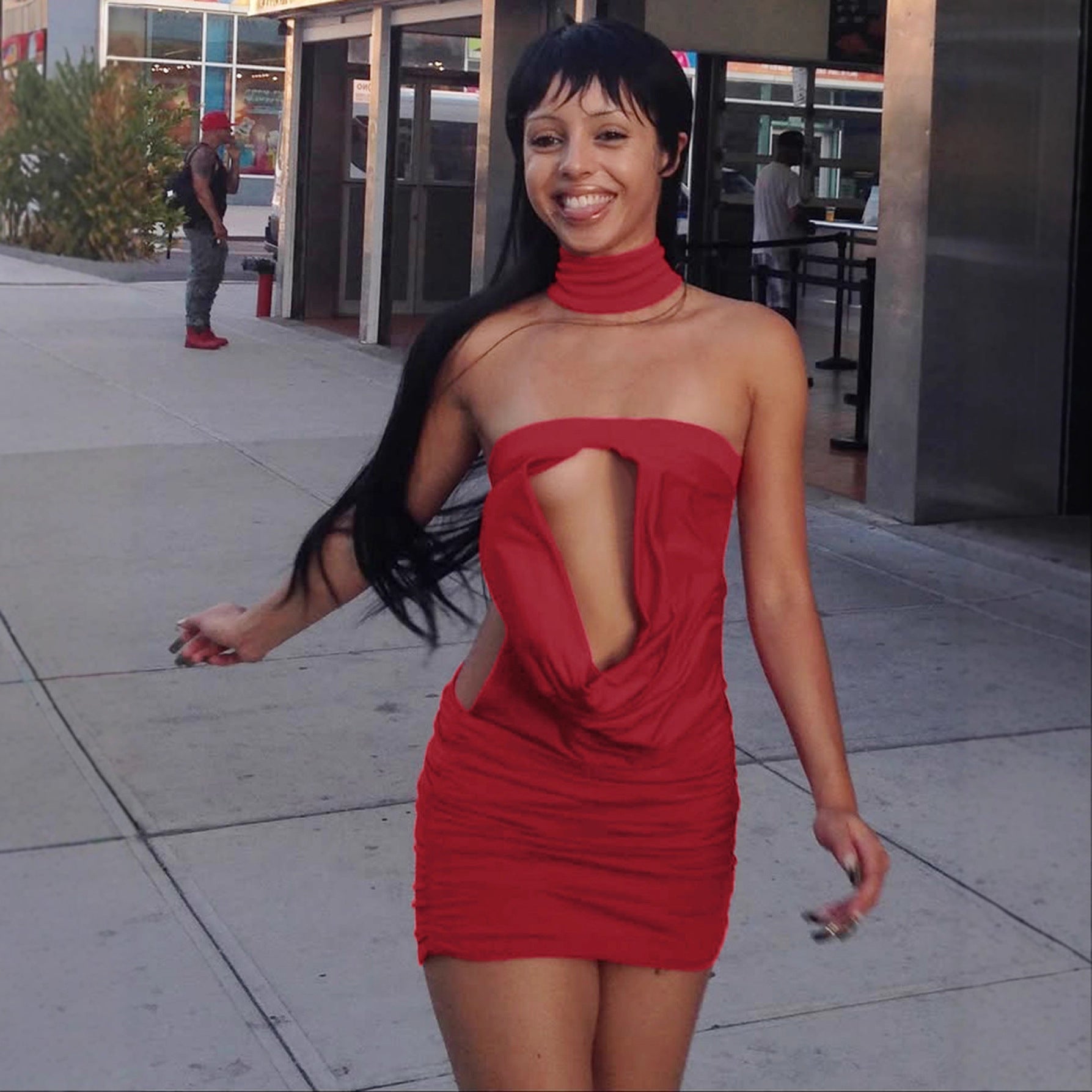 Red backless dress angled view of the fitted waist and clean silhouette