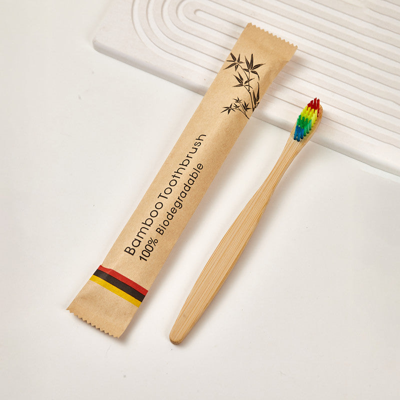Bamboo toothbrushes with assorted bristle colors arranged in a neat row