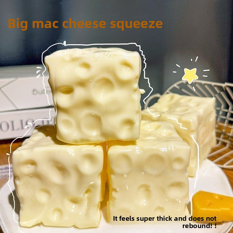 Pale yellow cheese cube squishies stacked on a plate, same maker panel for the 5 cm option