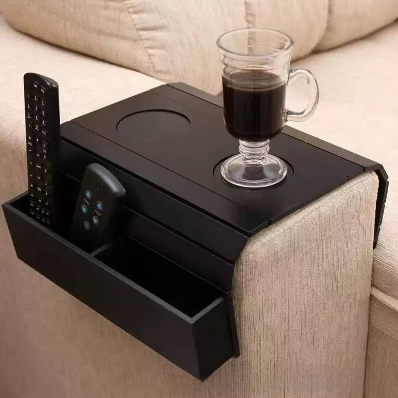 Black armrest tray on a sofa arm with a mug of coffee in a round cup holder and a remote in the side pocket, Style 1 option