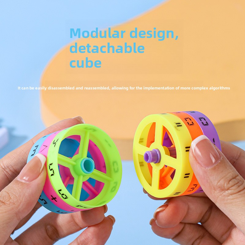 Two hands holding two halves of a colored number cylinder, showing the hollow hub with spokes