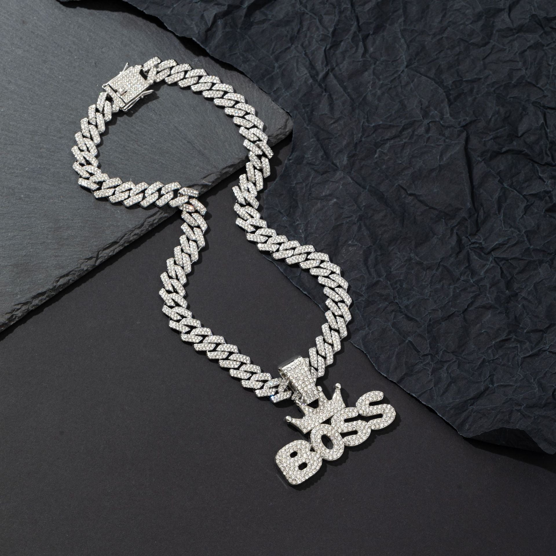 Alternative angle of the crown pendant necklace on its chain