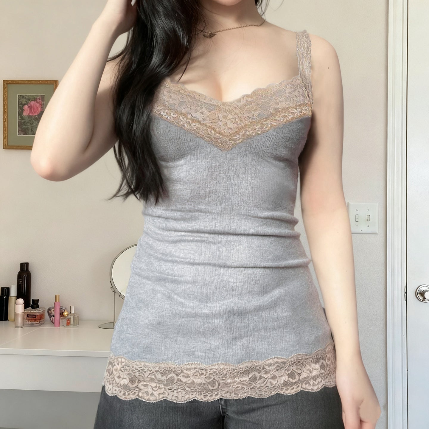 Close-up of the scalloped lace trim along the camisole V-neckline