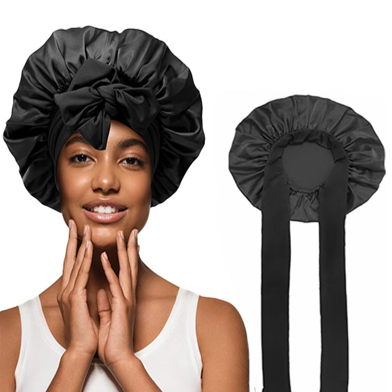 Large satin hair bonnet shown with the elastic band and two satin ties for the fit