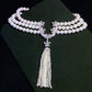 Maker example, the assembled pearl necklace on dark velvet showing the connector at the front