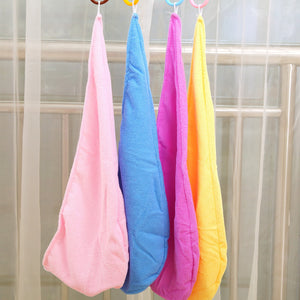 Cotton hair drying towel styled as a turban wrap on the head