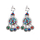 Handmade bohemian clip-on earrings with tassel and bead drop detail, zinc alloy frame, studio shot on white background