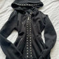 Black slim-fit zip-up hoodie with pyramid studs on the hood and front zip, size XXL option