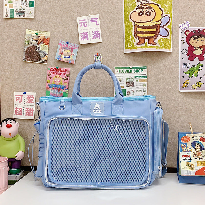 Roomy clear pocket shoulder bag in soft nylon with an adjustable detachable strap