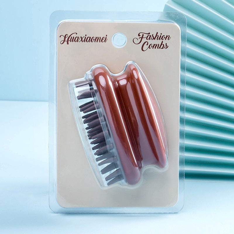 Rust and brown silicone scalp shampoo brush on a blister card with soft bristles