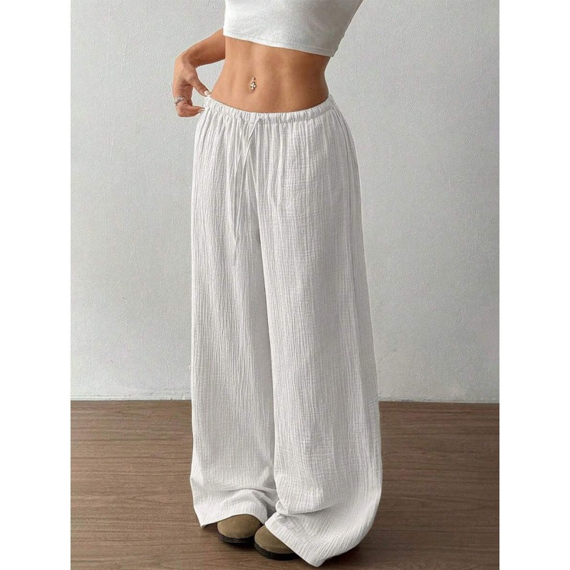 Full length view of wide leg palazzo cotton trousers falling to the floor