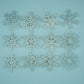 Set of glitter snowflake wall decals shown flat with assorted sizes and geometric shapes