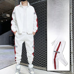 White hooded tracksuit set with red side stripe, full-zip jacket and joggers on model