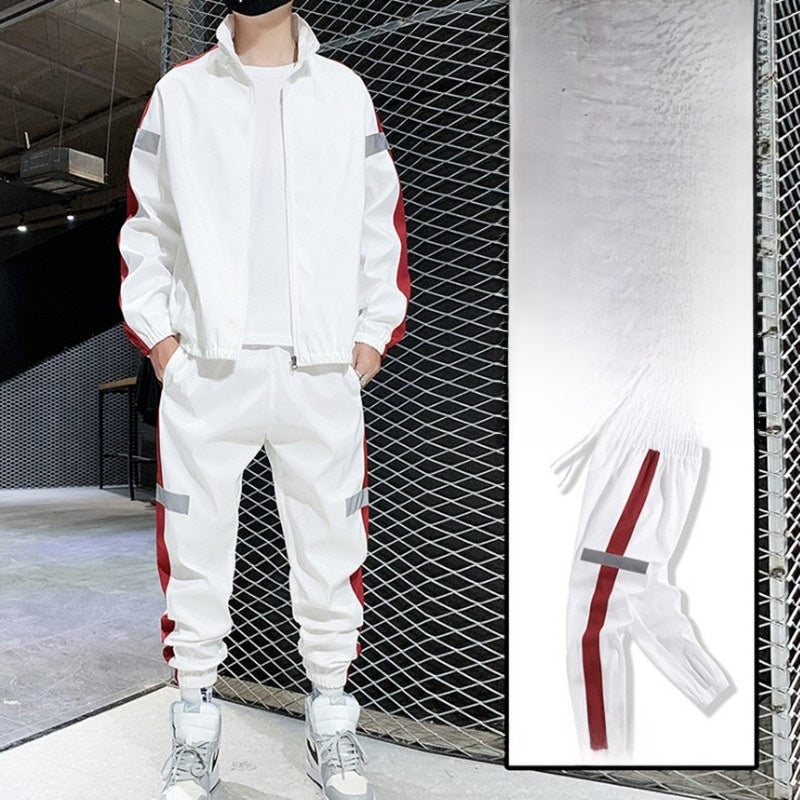 White hooded tracksuit set with red side stripe, full-zip jacket and joggers on model