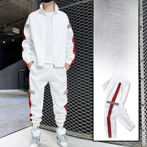 White hooded tracksuit set with red side stripe, full-zip jacket and joggers on model