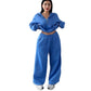 Model wearing the blue cropped half-zip sweatshirt and wide-leg sweatpants set, front view