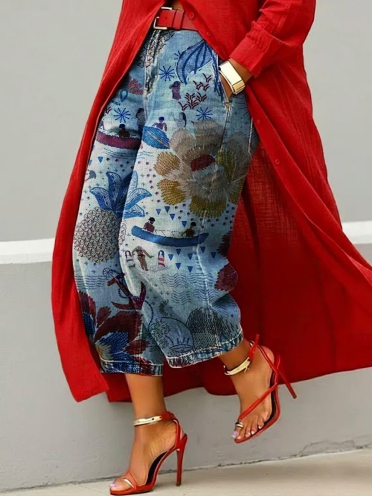 Wide leg cropped light blue denim jeans with boat scene and cream bloom print, red coat and heels