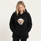Black teddy fleece hoodie with a small dog's head looking out of the chest opening above the front pocket