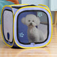 Blue pet drying box with a small white dog sitting behind the mesh door