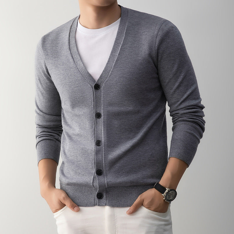 Black mens knit cardigan buttoned to show the fine knit and ribbed hem