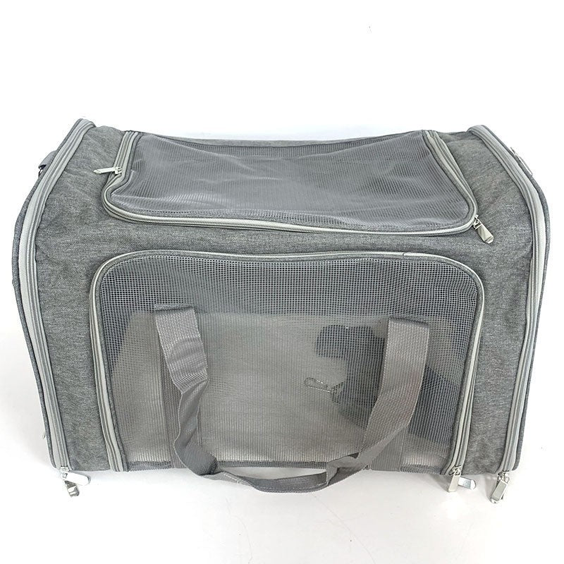 Grey pet carrier from above showing the zipped mesh roof window and the mesh front panel