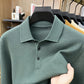 Bean green knit polo collar and three button placket close up with fabric held in hand