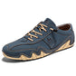 Dark blue microfiber low-top lace-up casual shoe with a wavy cream lug sole, three quarter view, size option 38