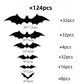Black self adhesive bat stickers in several sizes on a light surface