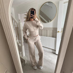 Womens two piece lounge set, a front zip jacket and straight leg drawstring pants in a soft sweat knit