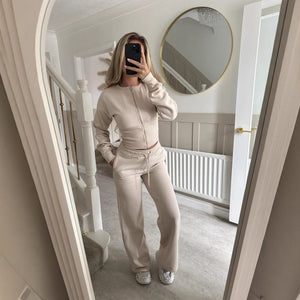 Womens two piece lounge set, a front zip jacket and straight leg drawstring pants in a soft sweat knit