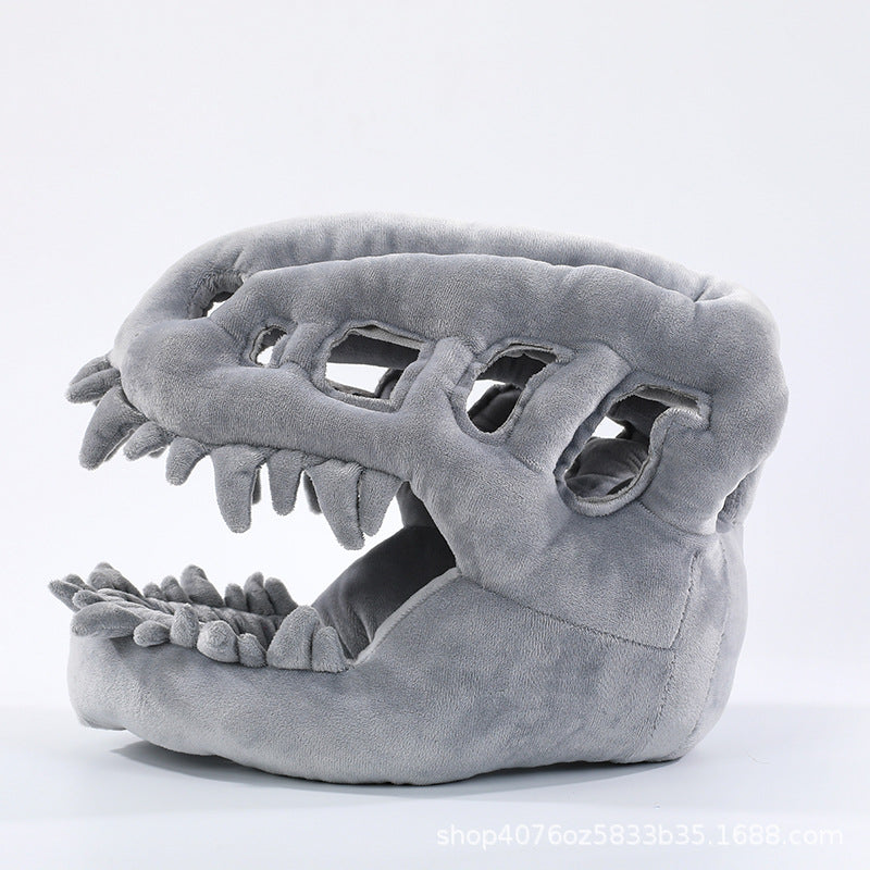 Plush dinosaur skeleton headgear with open jaw teeth and a long padded backbone tail for dress-up