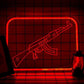 LED neon gaming wall sign glowing next to a monitor