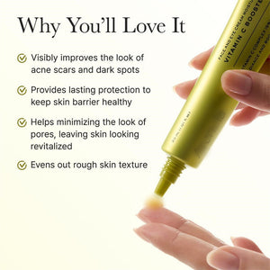 Two drops of the brightening serum pooled in an open palm