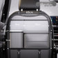 Car seat back organizer mounted on the headrest posts seen from the back seat