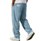 Back view of the wide wale corduroy trousers showing patch pockets and a woven flag label
