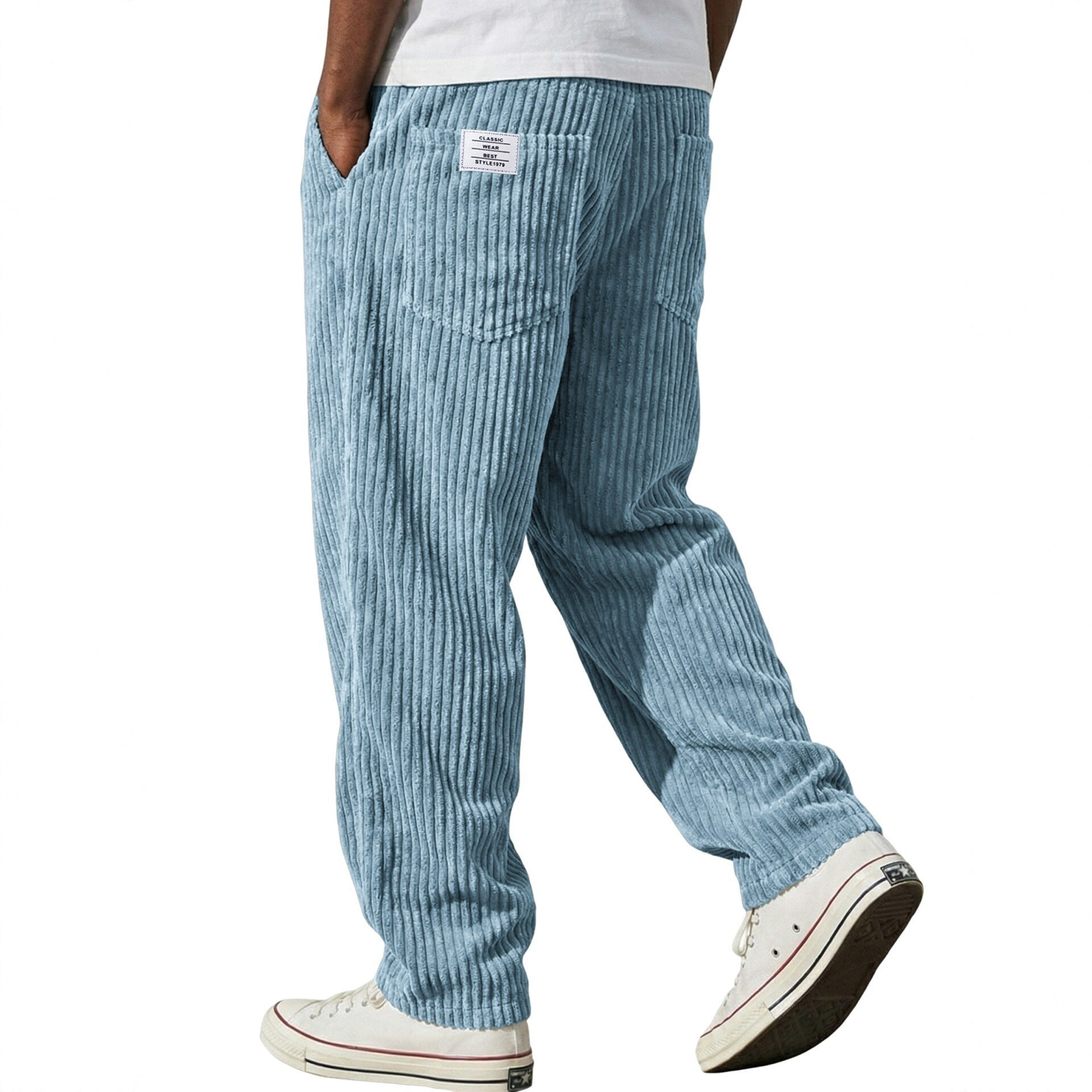 Back view of the wide wale corduroy trousers showing patch pockets and a woven flag label