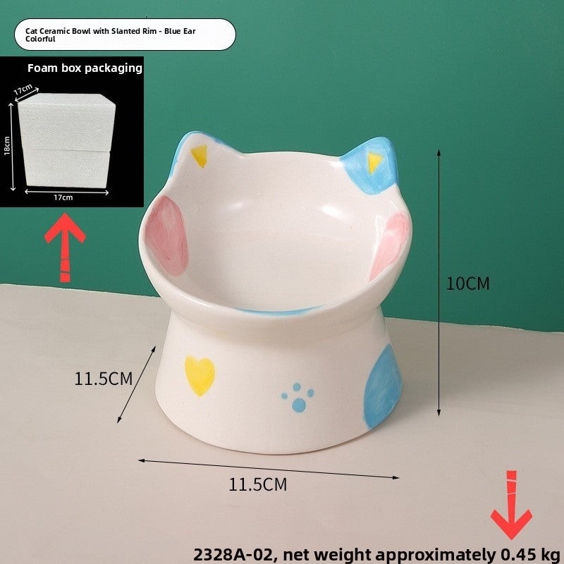 Cat ear ceramic raised bowl with blue ears, pink cheek patches and a yellow heart, 11.5 by 11.5 cm and 10 cm high
