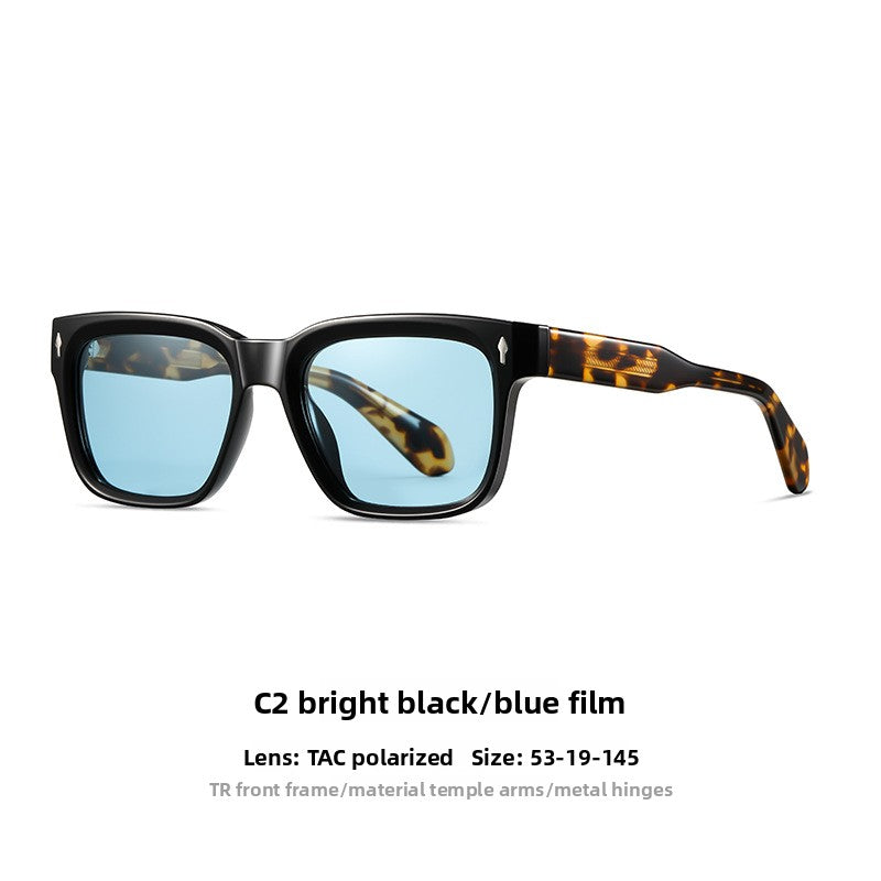 Retro square sunglasses in a bright black frame with gray polarized lenses