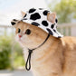 Pet bucket sun hat with ear holes and chin cord in black and white cow print, view 38