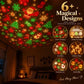 Red and green Christmas projection patterns of trees, snowflakes, Santa and stockings across a bedroom ceiling