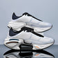 Chunky unisex lace up sneaker with a fabric upper and a sculpted rubber sole worn on the street