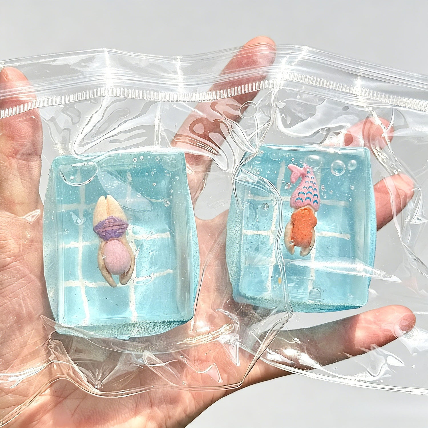 Close up of a clear ocean squishy toy with a mermaid figure sealed inside