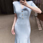 Elegant V-neck knitted dress, side profile showing the fitted waist