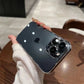 Black iPhone with a clear hard case on the back held in a hand over a wooden table
