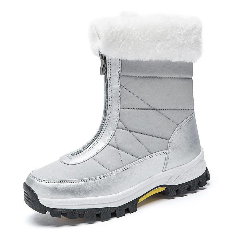 Silver plush lined snow boot with round toe and blocky lugged outsole on white